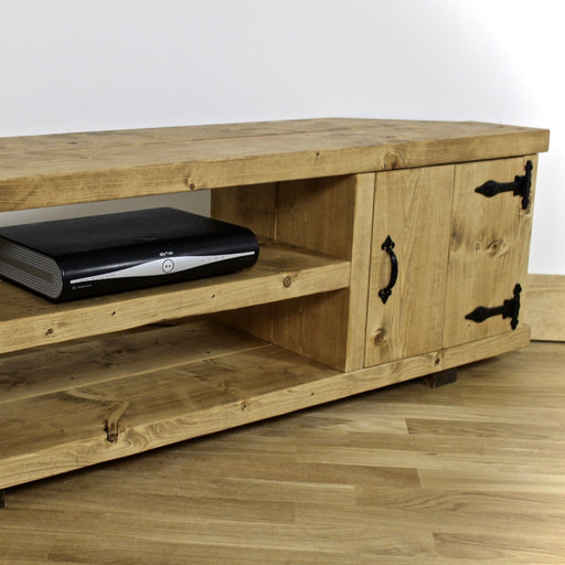 Solid Wood TV Unit in a medium oak finish, featuring a cupboard with door for added storage in a chunky rustic style. Hand crafted in the New Forest.